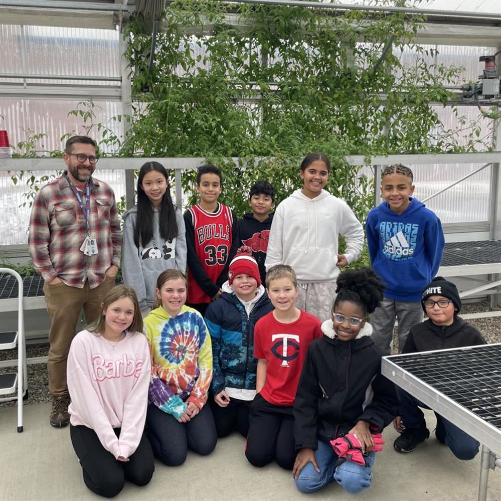  Teacher and students in the CBPA greenhouse